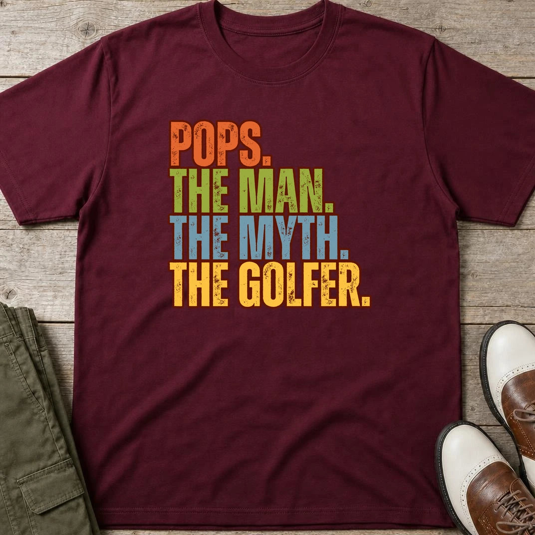 Pops Myth Golfer T-Shirt in Maroon lying on a plain floor. T-shirt is a unisex cut and 100 per cent cotton.