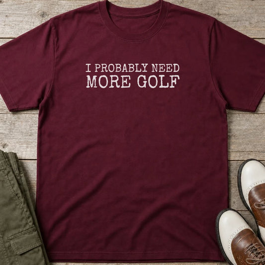 Probably Need T-Shirt in Maroon lying on a plain floor. T-shirt is a unisex cut and 100 per cent cotton.