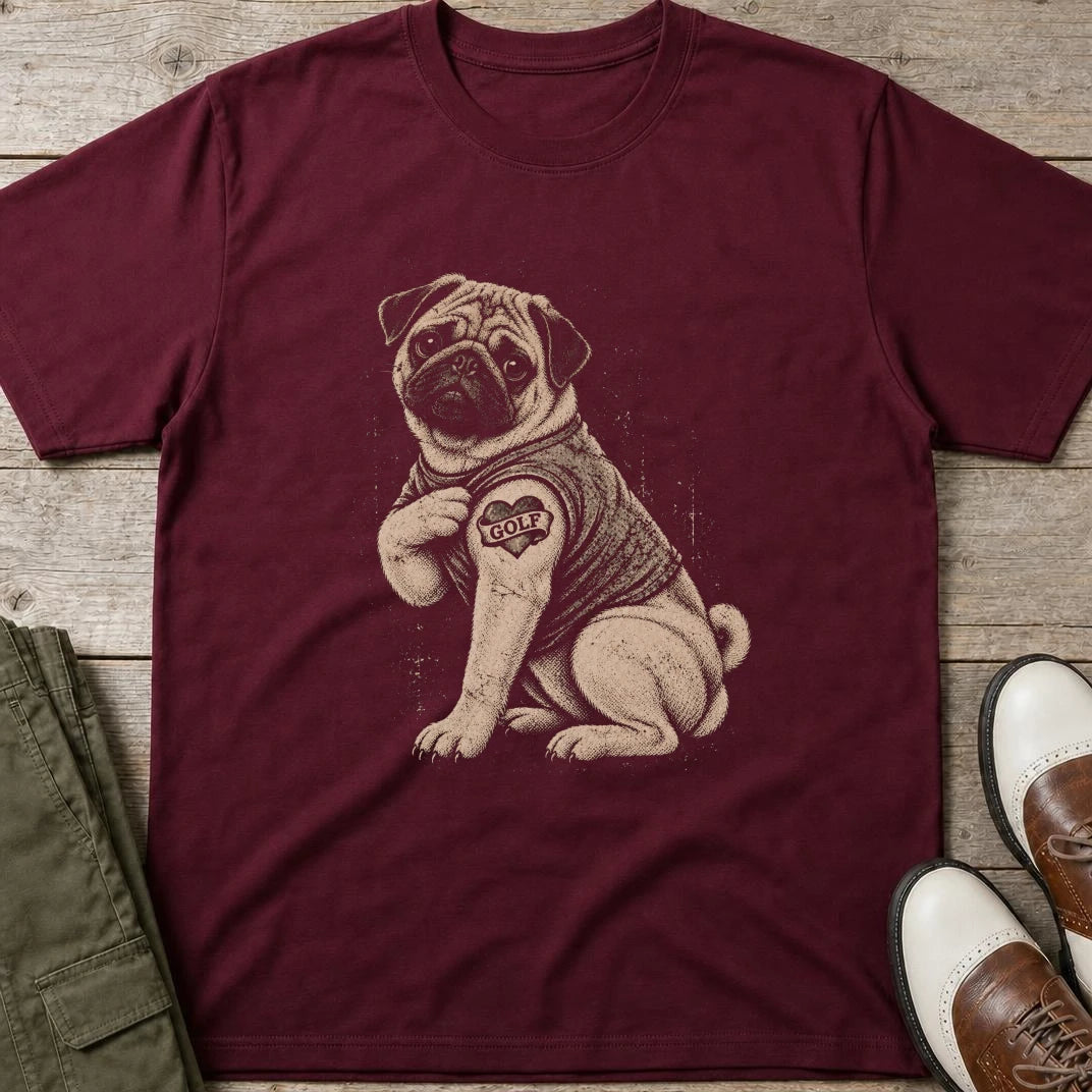 Pug Golfer T-Shirt in Maroon lying on a plain floor. T-shirt is a unisex cut and 100 per cent cotton.