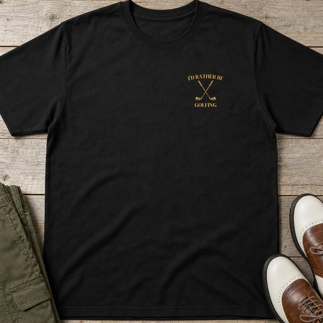Rather Be Pocket T-Shirt in Black lying on a plain floor. T-shirt is a unisex cut and 100 per cent cotton.