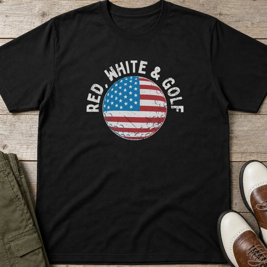 Red White & Golf T-Shirt in Black lying on a plain floor. T-shirt is a unisex cut and 100 per cent cotton.