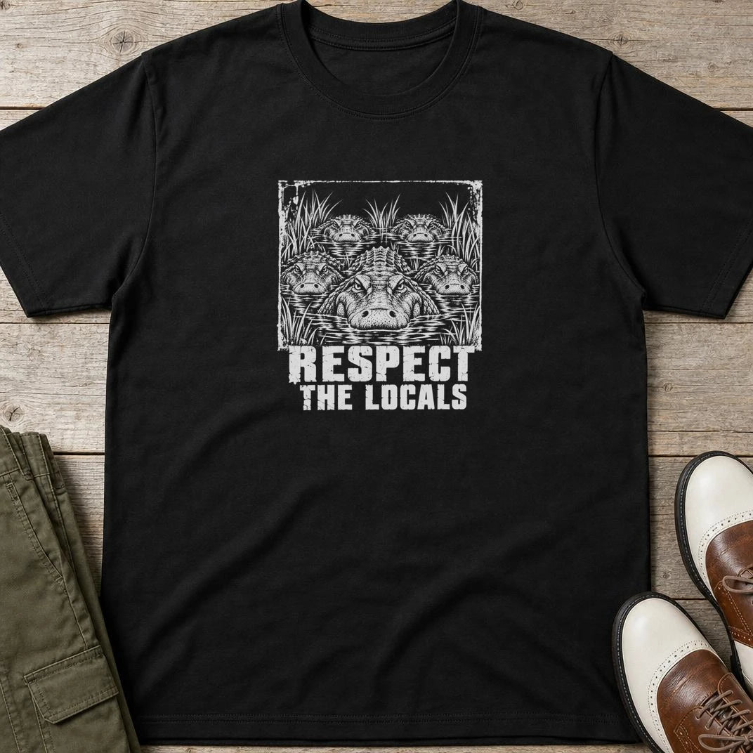 Respect T-Shirt in Black lying on a plain floor. T-shirt is a unisex cut and 100 per cent cotton.