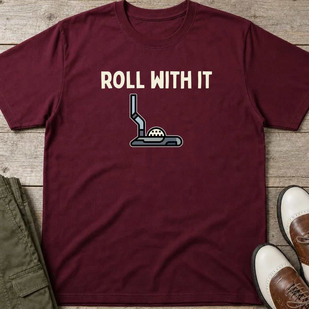 Roll With It T-Shirt in Maroon lying on a plain floor. T-shirt is a unisex cut and 100 per cent cotton.