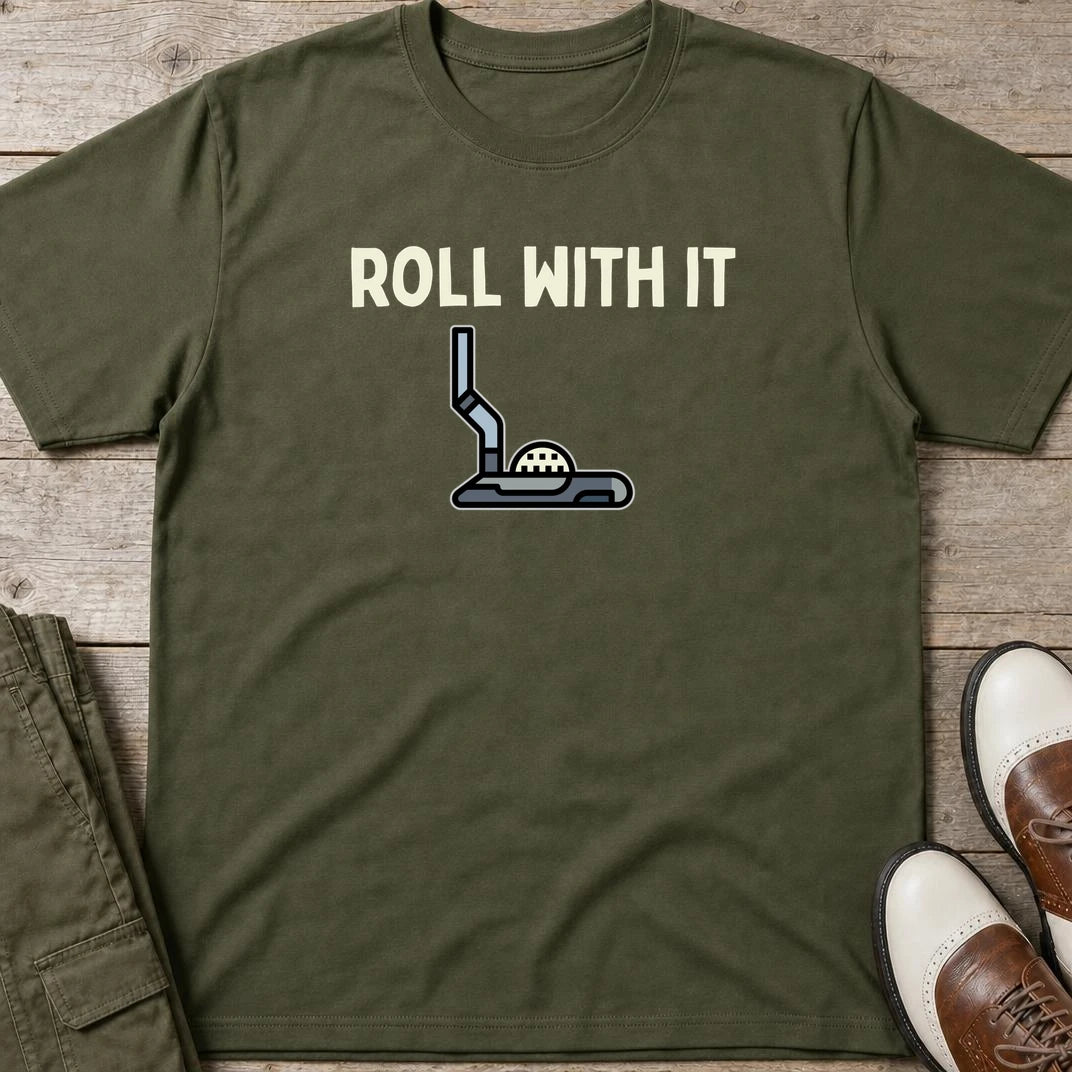 Roll With It T-Shirt in Military Green lying on a plain floor. T-shirt is a unisex cut and 100 per cent cotton.