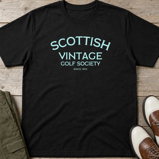 Scottish 1903 T-Shirt in Black lying on a plain floor. T-shirt is a unisex cut and 100 per cent cotton.