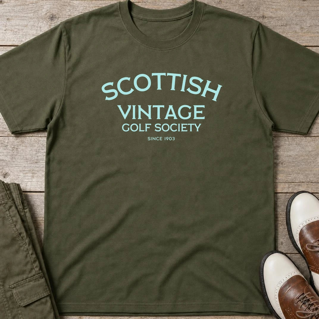 Scottish 1903 T-Shirt in Military Green lying on a plain floor. T-shirt is a unisex cut and 100 per cent cotton.
