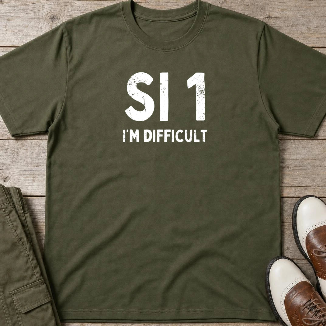 SI 1 T-Shirt in Military Green lying on a plain floor. T-shirt is a unisex cut and 100 per cent cotton.