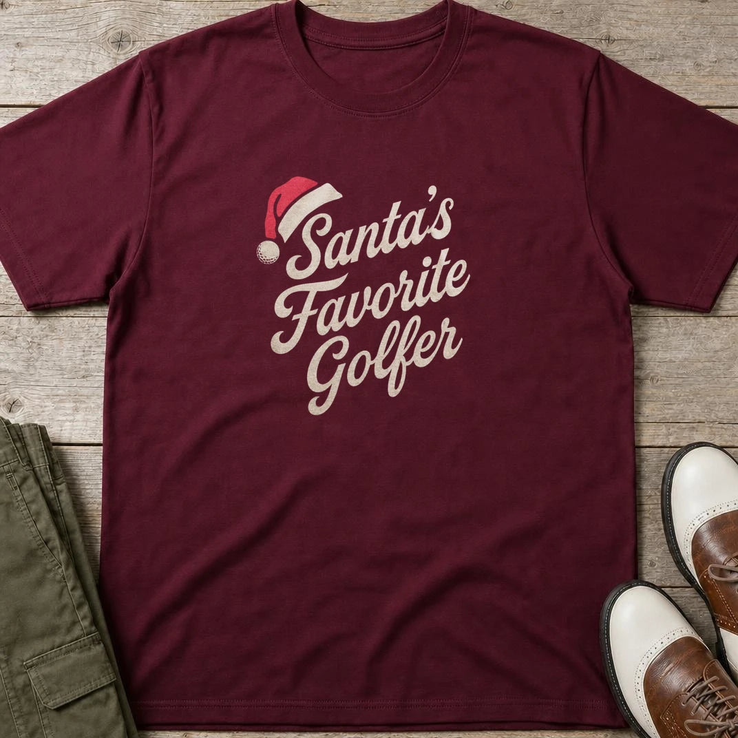 Santa's Favorite T-Shirt in Maroon lying on a plain floor. T-shirt is a unisex cut and 100 per cent cotton.