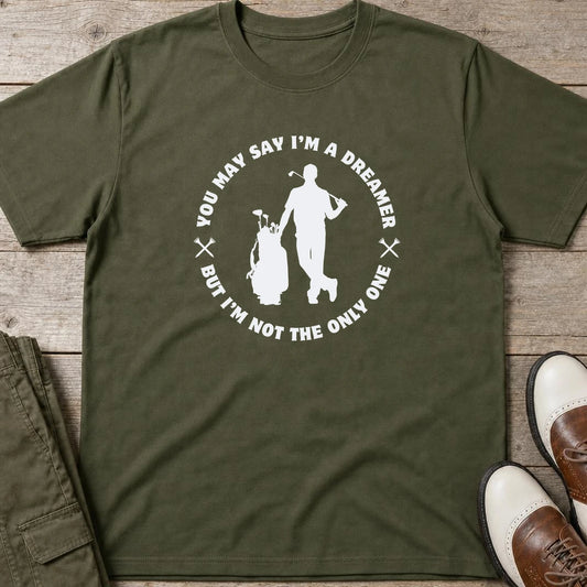 You May Say I'm A Dreamer T-Shirt in Military Green lying on a plain floor. T-shirt is a unisex cut and 100 per cent cotton.