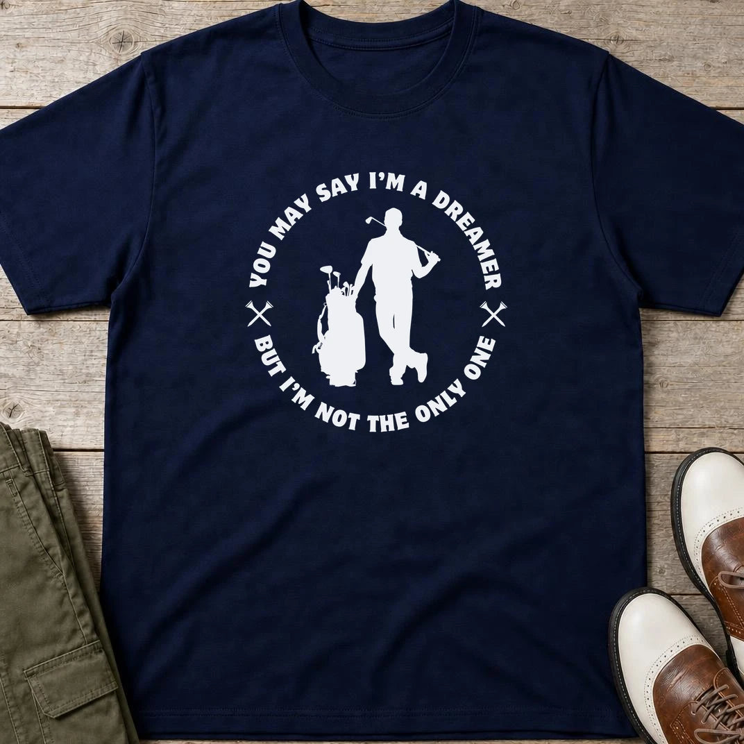 You May Say I'm A Dreamer T-Shirt in Navy lying on a plain floor. T-shirt is a unisex cut and 100 per cent cotton.