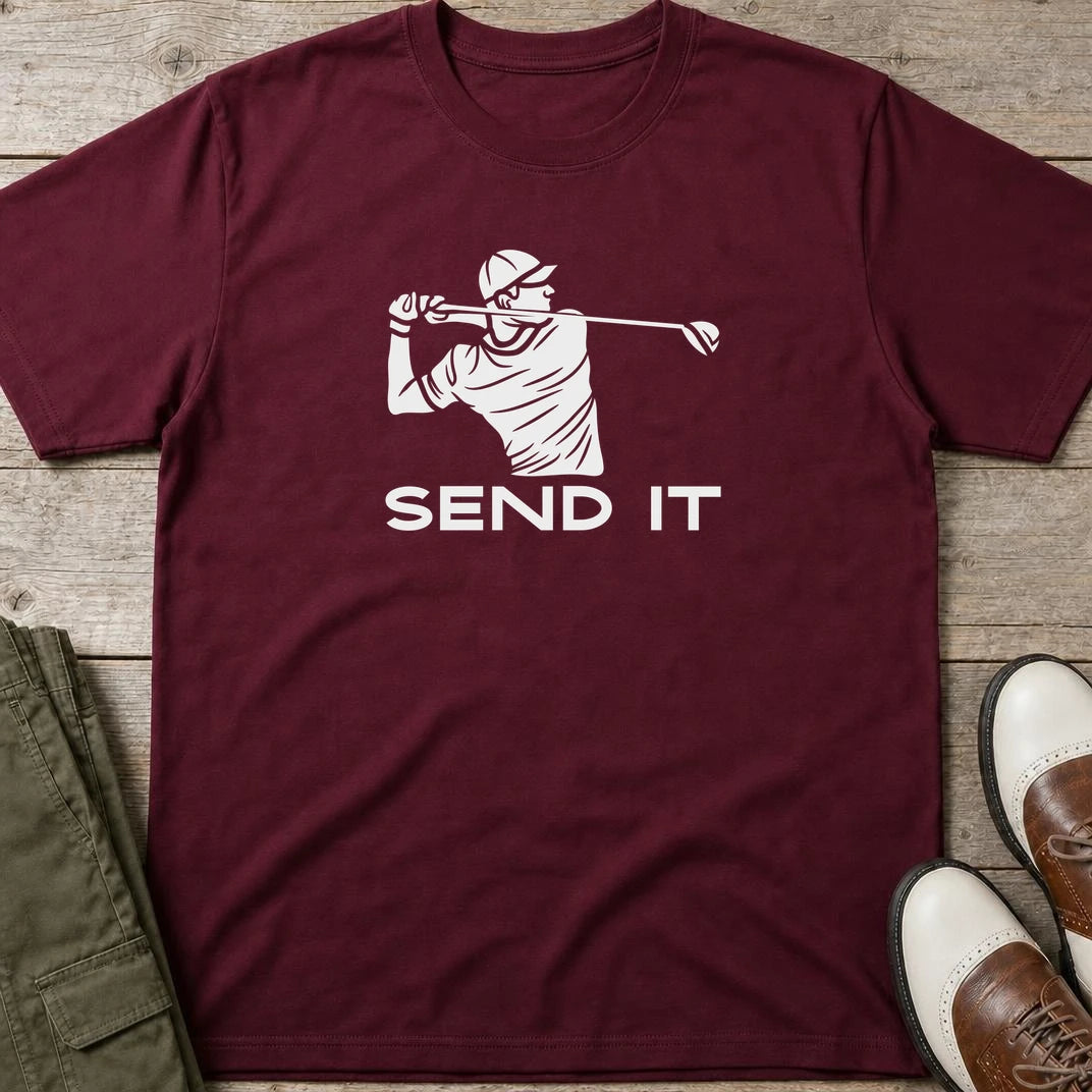 Send It T-Shirt in Maroon lying on a plain floor. T-shirt is a unisex cut and 100 per cent cotton.