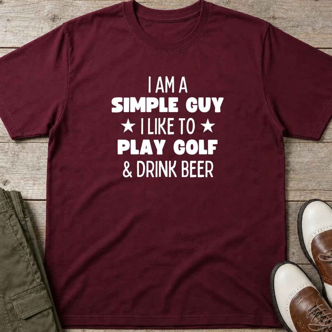 Simple Guy T-Shirt in Maroon lying on a plain floor. T-shirt is a unisex cut and 100 per cent cotton.