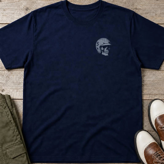 Skull Golfer Pocket T-Shirt in Navy lying on a plain floor. T-shirt is a unisex cut and 100 per cent cotton.