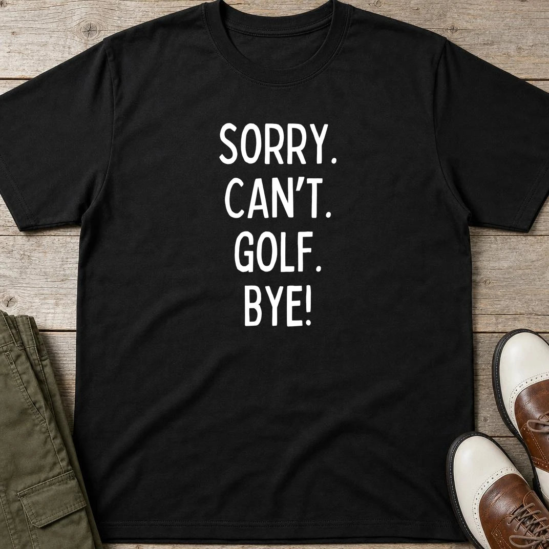 Sorry. Golf T-Shirt in Black lying on a plain floor. T-shirt is a unisex cut and 100 per cent cotton.