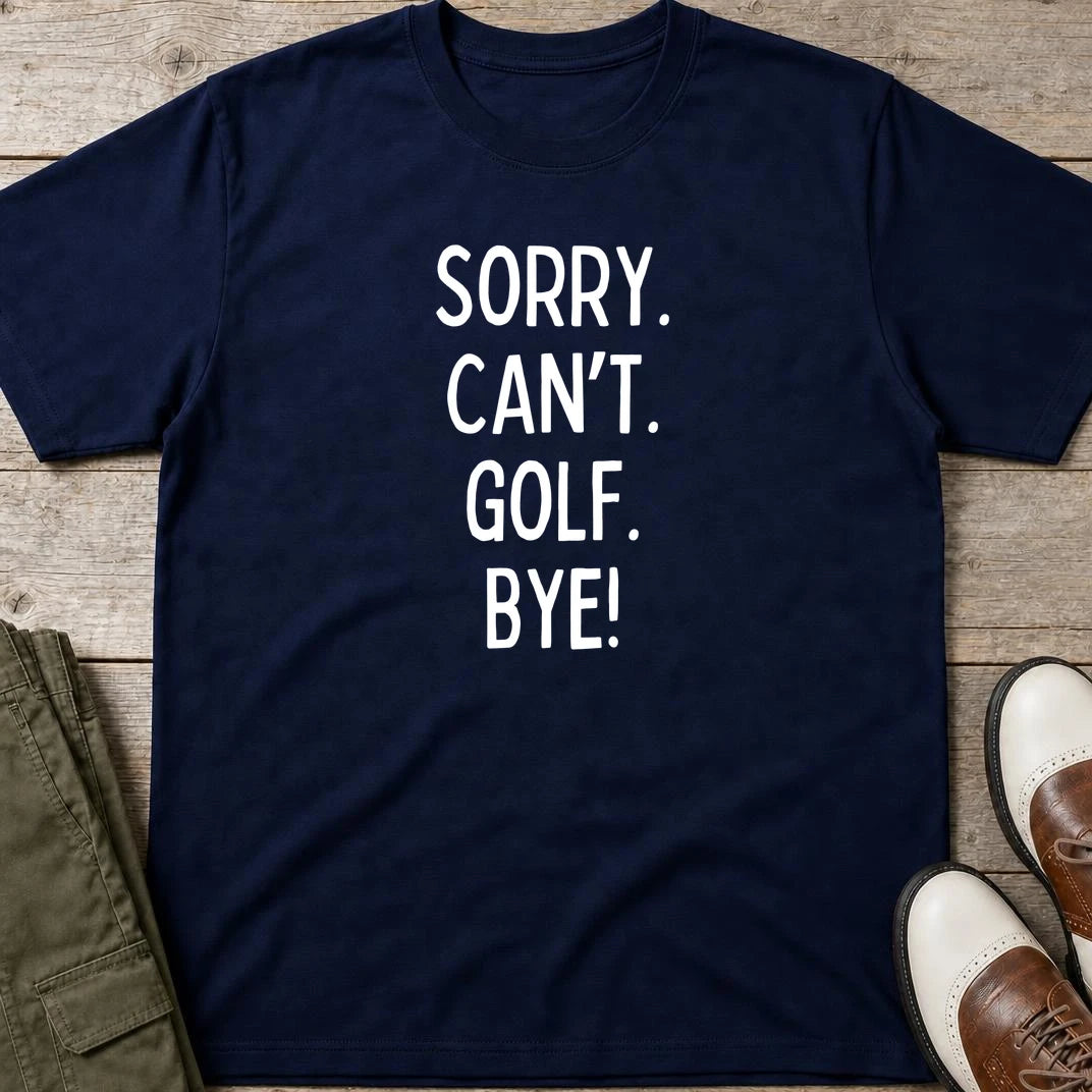 Sorry. Golf T-Shirt in Navy lying on a plain floor. T-shirt is a unisex cut and 100 per cent cotton.