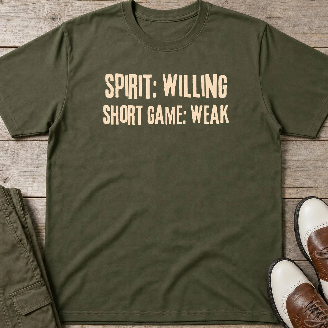 Spirit Willing T-Shirt in Military Green lying on a plain floor. T-shirt is a unisex cut and 100 per cent cotton.