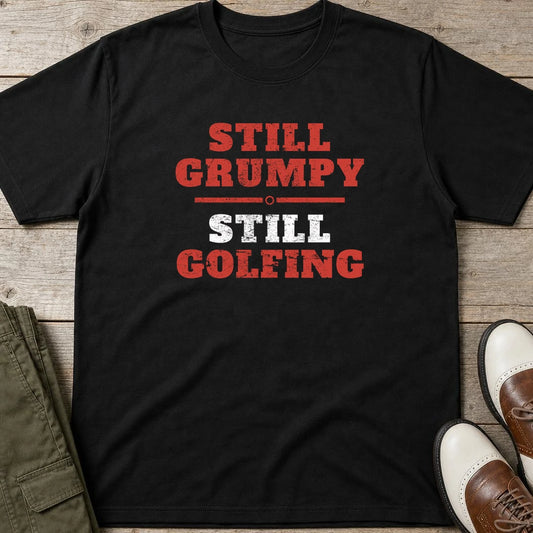 Still Grumpy Red T-Shirt in Black lying on a plain floor. T-shirt is a unisex cut and 100 per cent cotton.