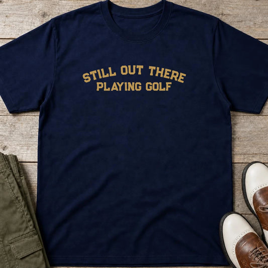 Still Out There T-Shirt in Navy lying on a plain floor. T-shirt is a unisex cut and 100 per cent cotton.