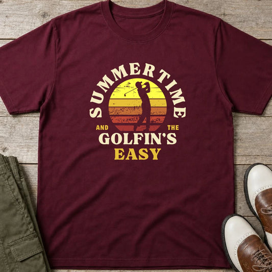 Summertime T-Shirt in Maroon lying on a plain floor. T-shirt is a unisex cut and 100 per cent cotton.