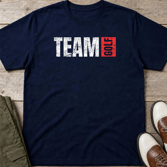 Team Golf T-Shirt in Navy lying on a plain floor. T-shirt is a unisex cut and 100 per cent cotton.