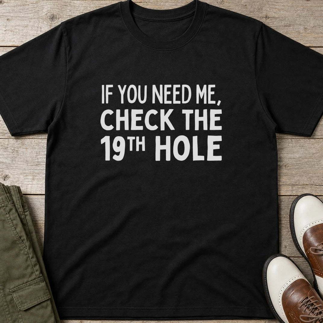 Check The 19th T-Shirt in Black lying on a plain floor. T-shirt is a unisex cut and 100 per cent cotton.