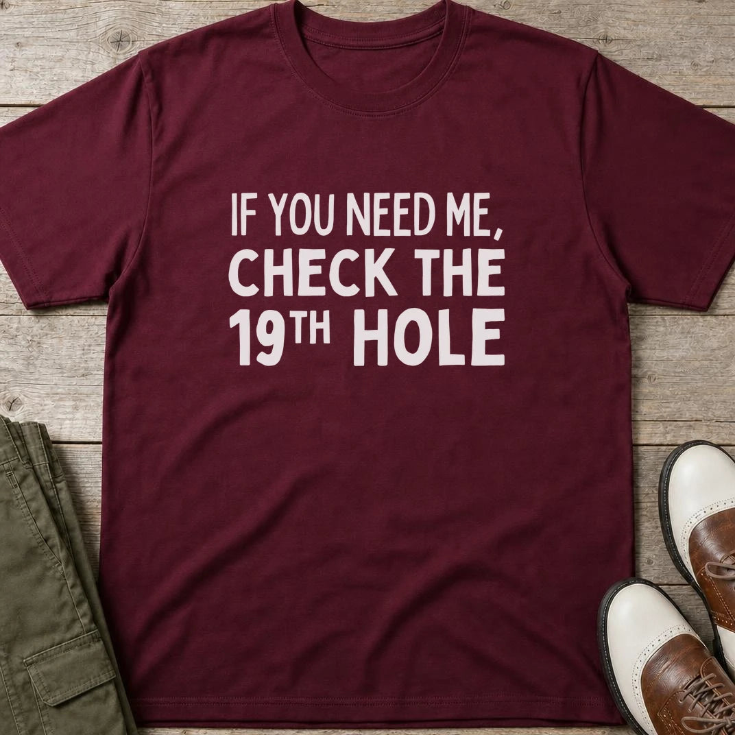 Check The 19th T-Shirt in Maroon lying on a plain floor. T-shirt is a unisex cut and 100 per cent cotton.