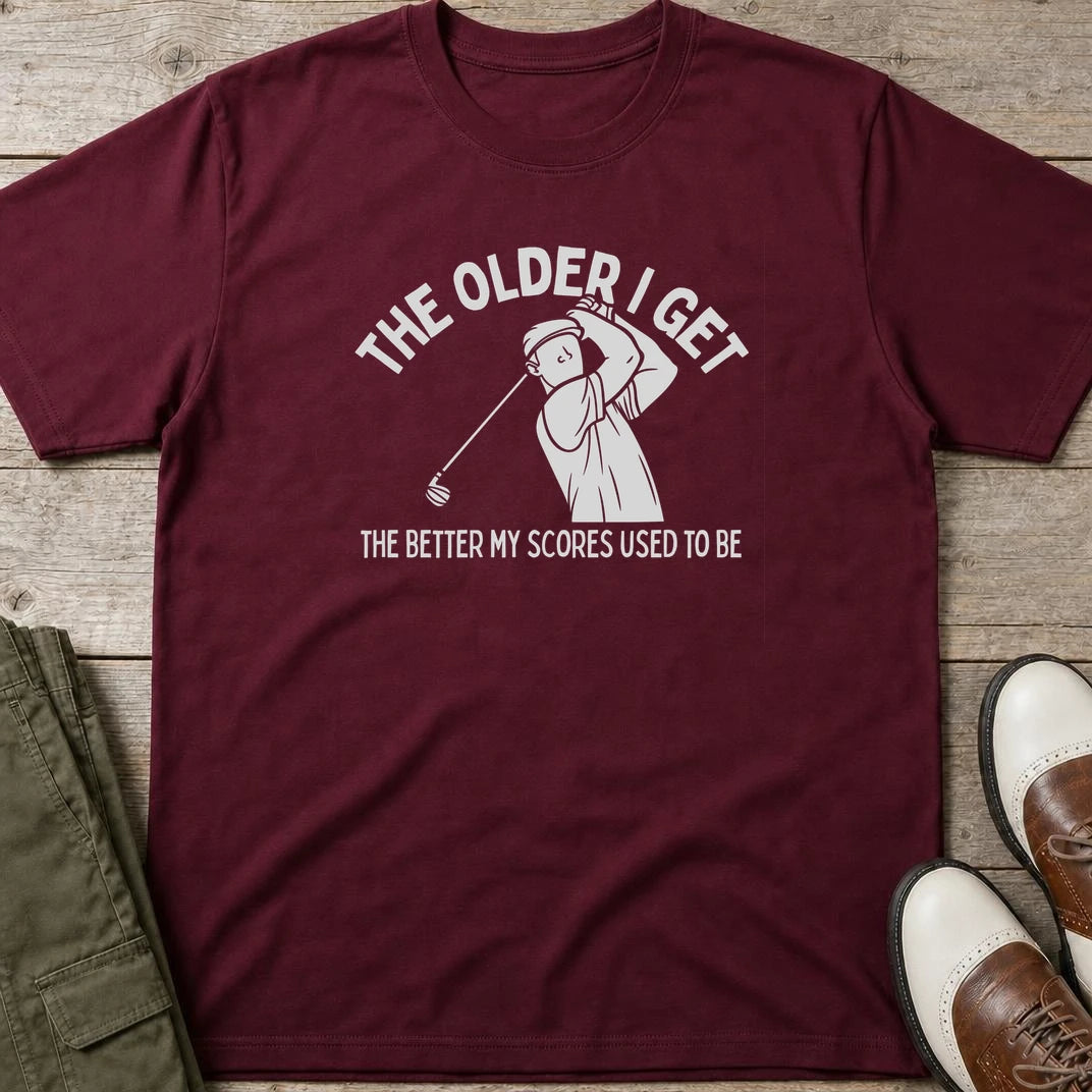 Older I Get T-Shirt in Maroon lying on a plain floor. T-shirt is a unisex cut and 100 per cent cotton.