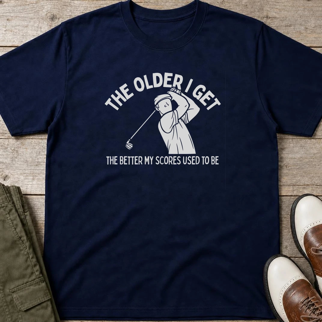 Older I Get T-Shirt in Navy lying on a plain floor. T-shirt is a unisex cut and 100 per cent cotton.