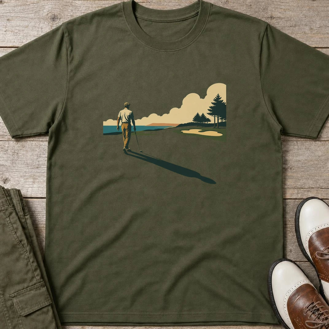 The Walk T-Shirt in Military Green lying on a plain floor. T-shirt is a unisex cut and 100 per cent cotton.