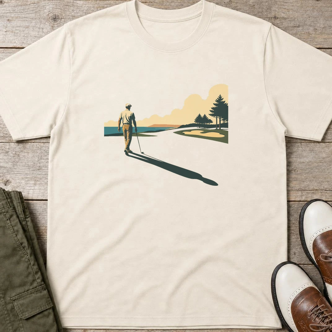 The Walk T-Shirt in Natural lying on a plain floor. T-shirt is a unisex cut and 100 per cent cotton.