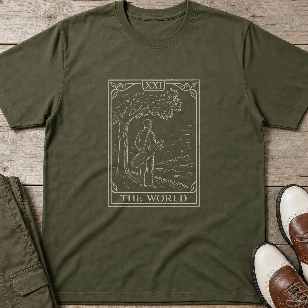 The World T-Shirt in Military Green lying on a plain floor. T-shirt is a unisex cut and 100 per cent cotton.
