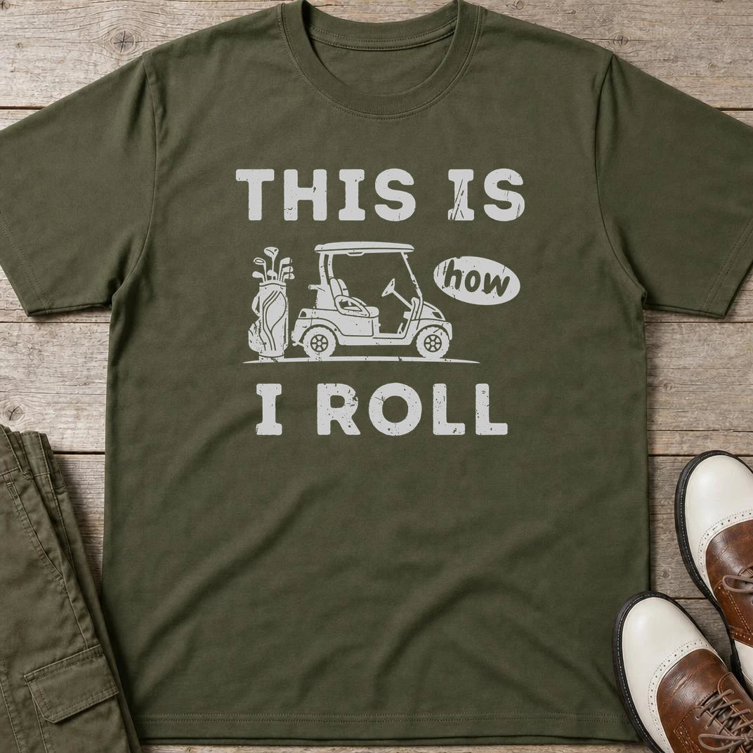 How I Roll T-Shirt in Military Green lying on a plain floor. T-shirt is a unisex cut and 100 per cent cotton.