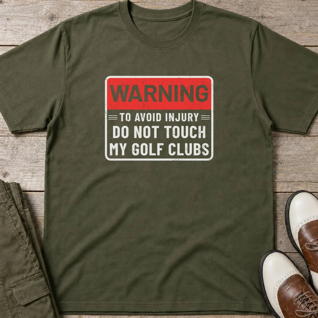 To Avoid Injury T-Shirt in Military Green lying on a plain floor. T-shirt is a unisex cut and 100 per cent cotton.