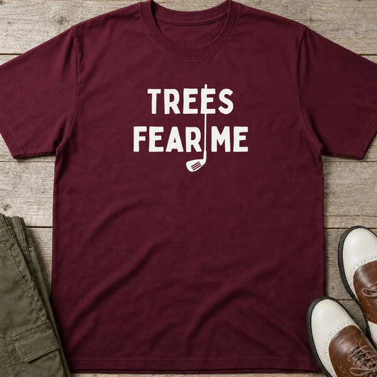 Trees Fear Me T-Shirt in Maroon lying on a plain floor. T-shirt is a unisex cut and 100 per cent cotton.