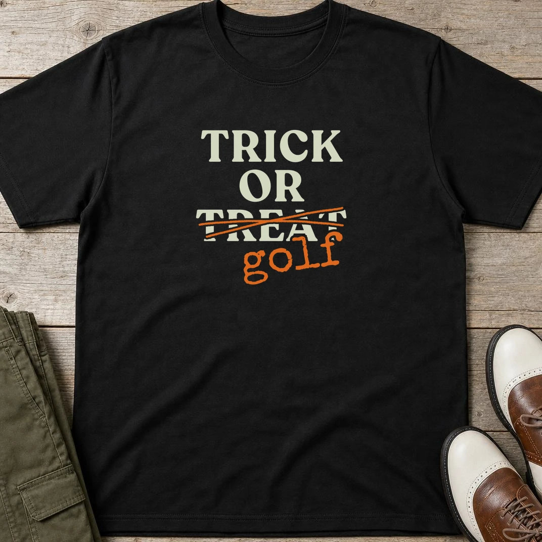 Trick Or T-Shirt in Black lying on a plain floor. T-shirt is a unisex cut and 100 per cent cotton.