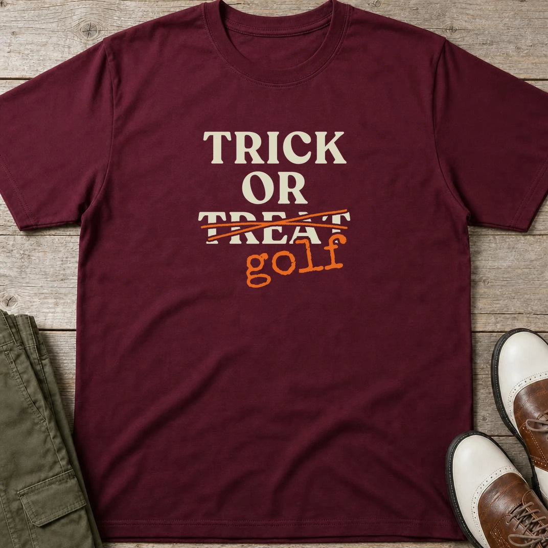 Trick Or T-Shirt in Maroon lying on a plain floor. T-shirt is a unisex cut and 100 per cent cotton.