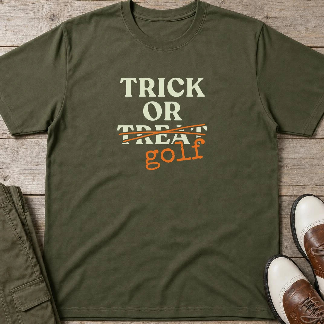 Trick Or T-Shirt in Military Green lying on a plain floor. T-shirt is a unisex cut and 100 per cent cotton.
