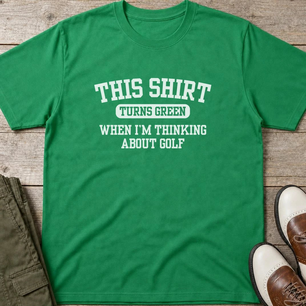Turns Green T-Shirt in lying on a plain floor. T-shirt is a unisex cut and 100 per cent cotton.