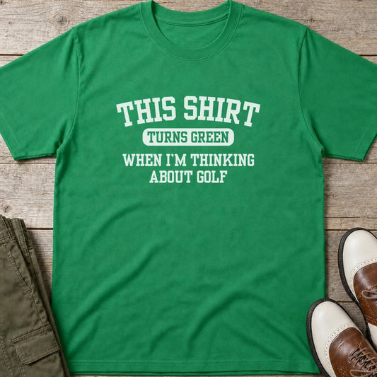 Turns Green T-Shirt in lying on a plain floor. T-shirt is a unisex cut and 100 per cent cotton.