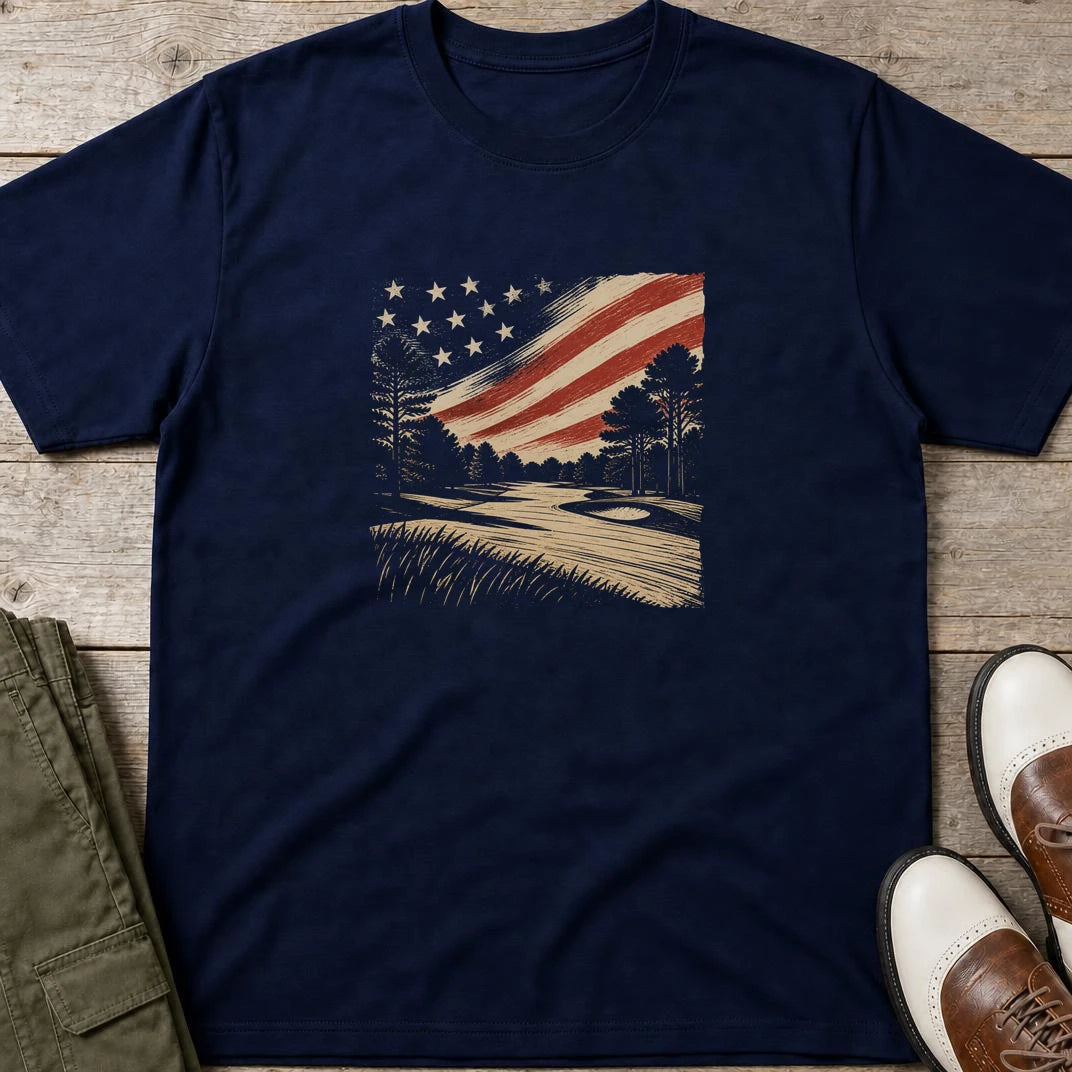 US Golf Course T-Shirt in Navy lying on a plain floor. T-shirt is a unisex cut and 100 per cent cotton.
