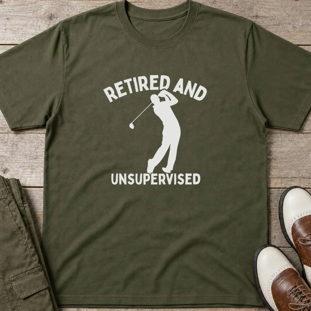 Unsupervised T-Shirt in Military Green lying on a plain floor. T-shirt is a unisex cut and 100 per cent cotton.