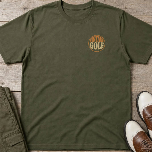 Vintage Golf Pocket T-Shirt in Military Green lying on a plain floor. T-shirt is a unisex cut and 100 per cent cotton.