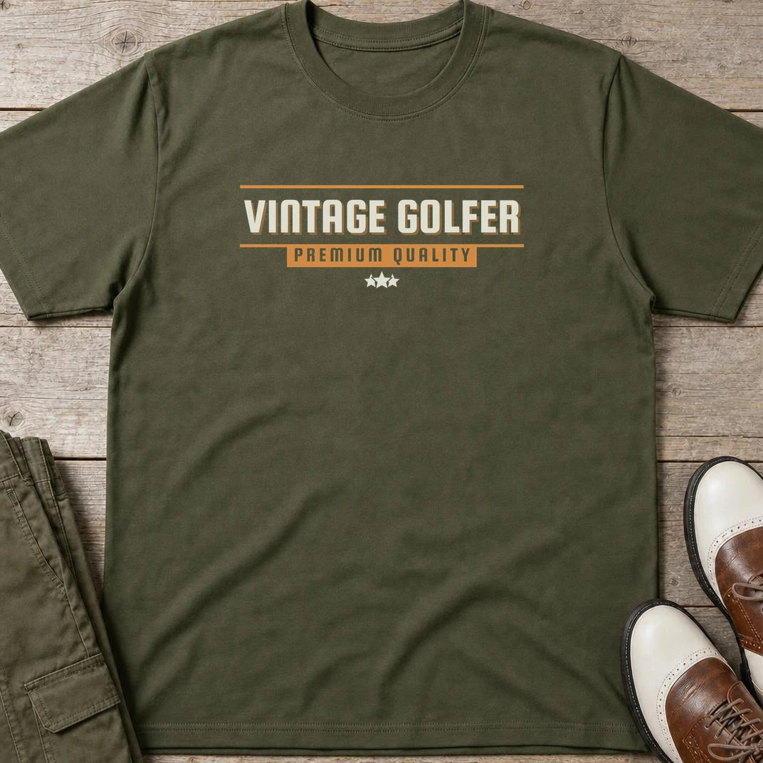 Vintage Golfer Quality T-Shirt in Military Green lying on a plain floor. T-shirt is a unisex cut and 100 per cent cotton.