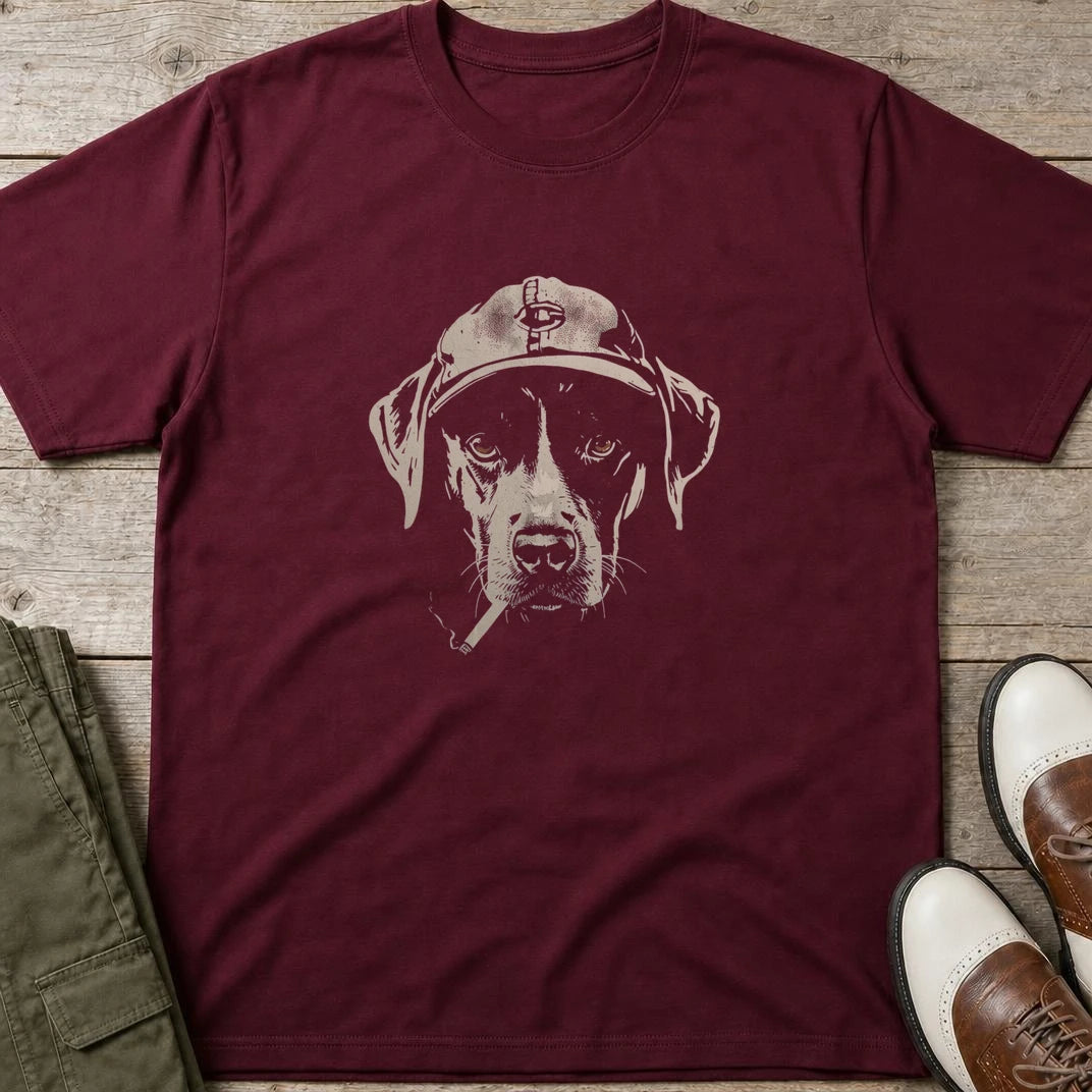Vintage Dog T-Shirt in Maroon lying on a plain floor. T-shirt is a unisex cut and 100 per cent cotton.