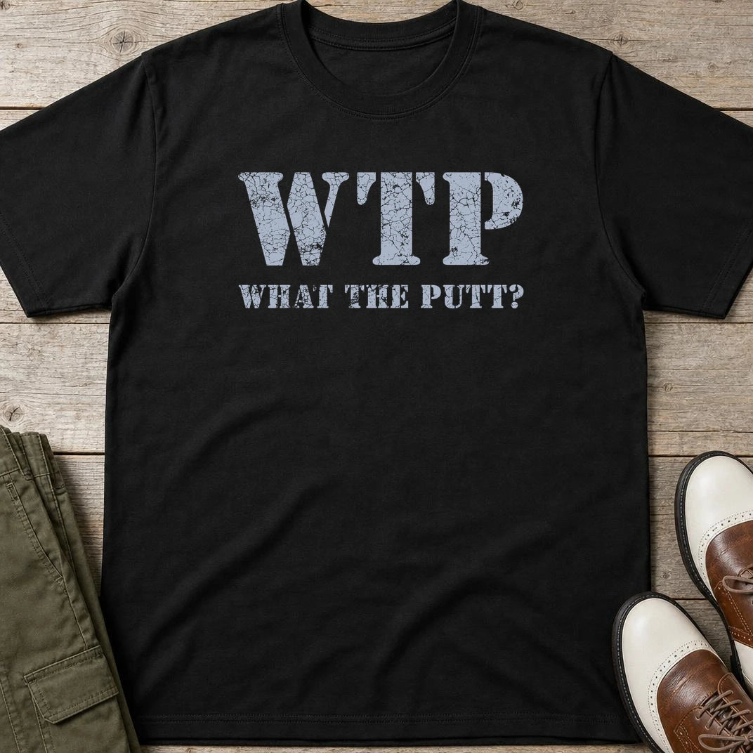 What The Putt T-Shirt in Black lying on a plain floor. T-shirt is a unisex cut and 100 per cent cotton.