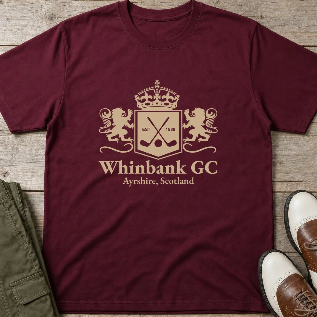 Whinbank GC T-Shirt in Maroon lying on a plain floor. T-shirt is a unisex cut and 100 per cent cotton.