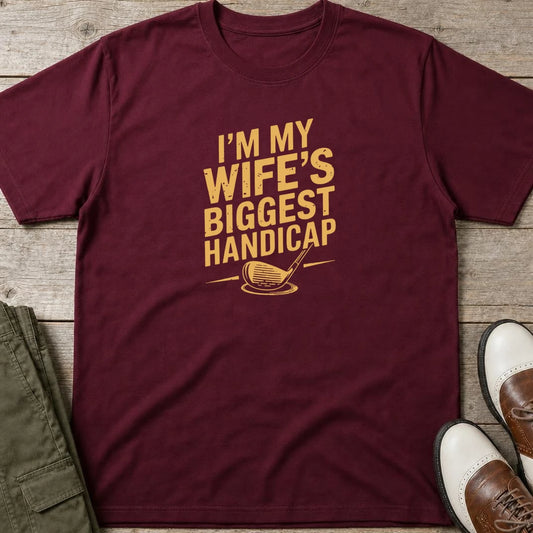 Biggest Handicap T-Shirt in Maroon lying on a plain floor. T-shirt is a unisex cut and 100 per cent cotton.