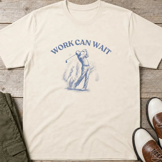 Work Can Wait T-Shirt in lying on a plain floor. T-shirt is a unisex cut and 100 per cent cotton.