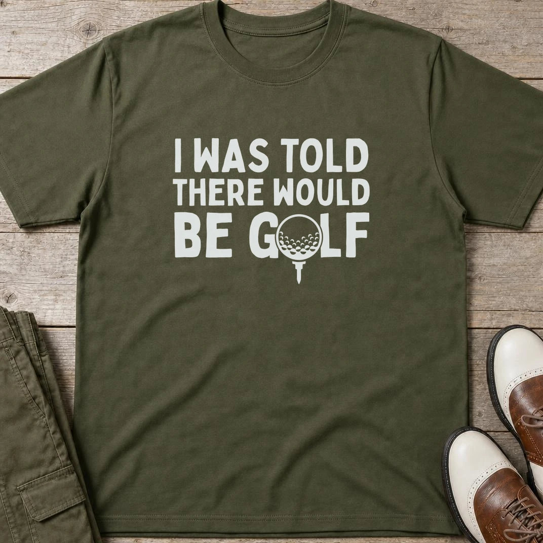 I Was Told T-Shirt in Military Green lying on a plain floor. T-shirt is a unisex cut and 100 per cent cotton.