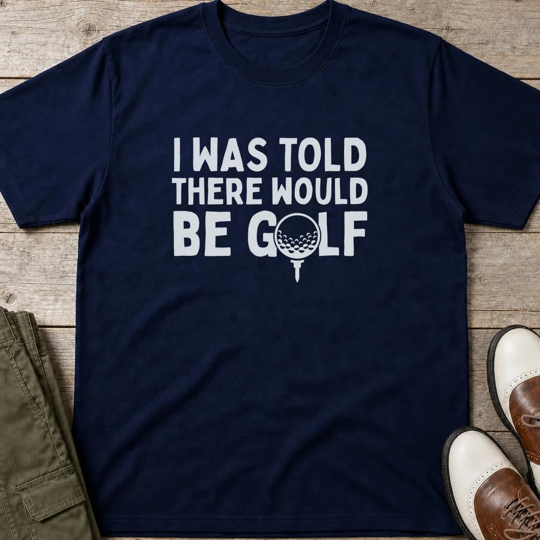 I Was Told T-Shirt in Navy lying on a plain floor. T-shirt is a unisex cut and 100 per cent cotton.